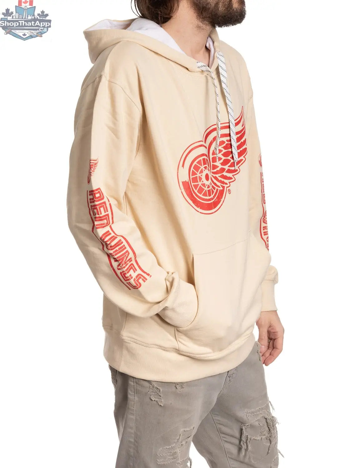 Red Detroit Red Wings hoodie by Calhoun Surf N' Skate, featuring team logo and hockey-inspired design on oatmeal-colored fabric.