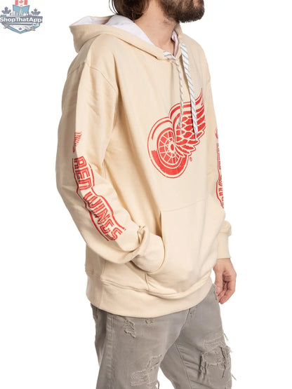 Red Detroit Red Wings hoodie by Calhoun Surf N' Skate, featuring team logo and hockey-inspired design on oatmeal-colored fabric.