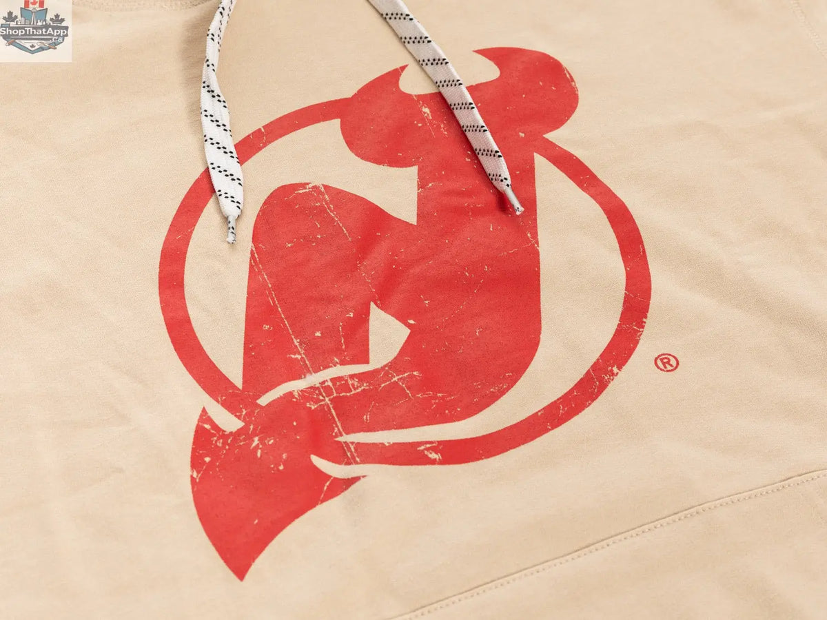 New Jersey Devils hoodie by Calhoun Surf N' Skate featuring team logo and oatmeal-colored fabric, perfect for game day vibes.