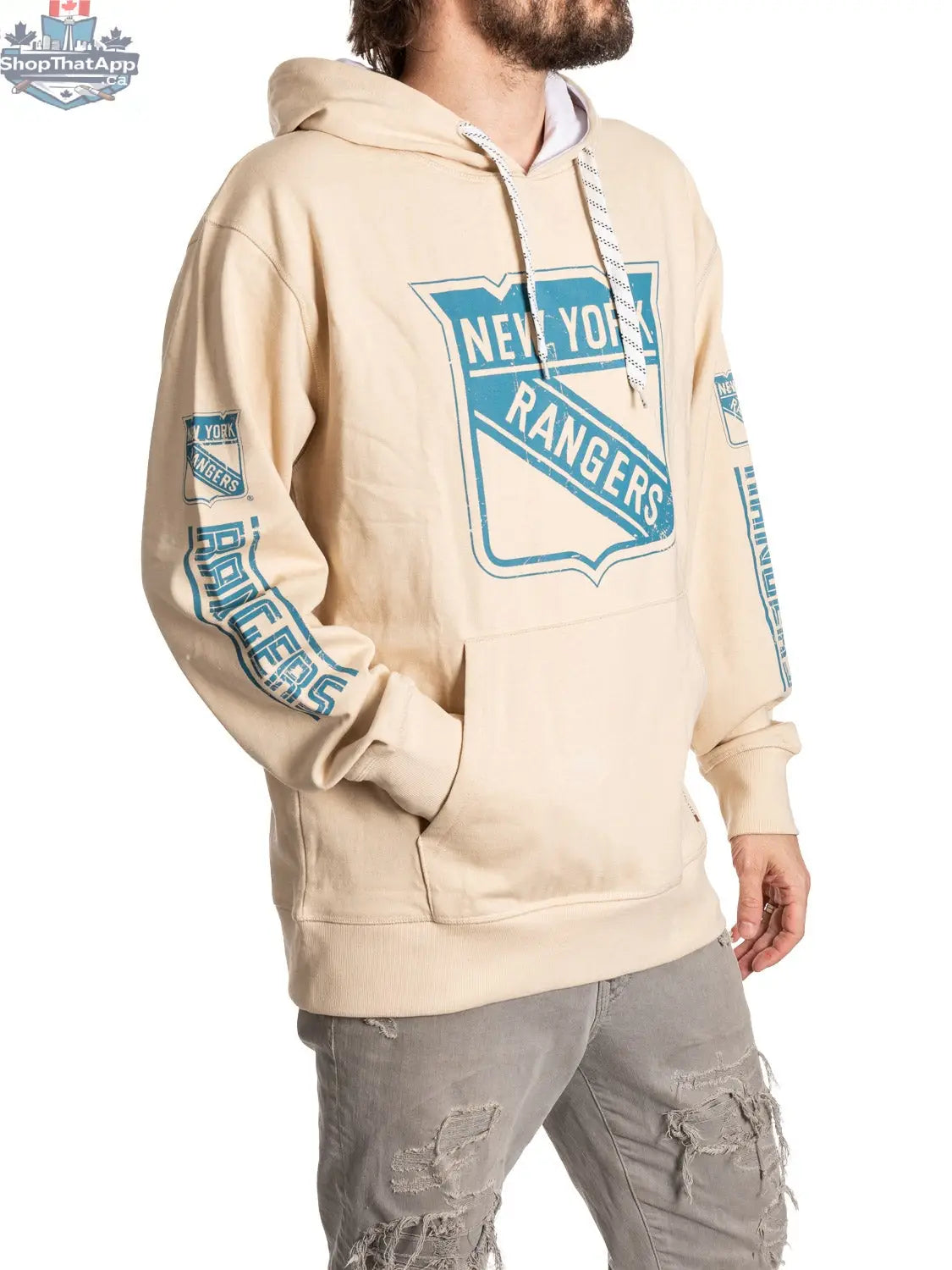 New York Rangers hoodie by Calhoun Surf N' Skate in oatmeal color, featuring team logo and casual fit on a model.