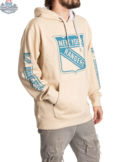 New York Rangers hoodie by Calhoun Surf N' Skate in oatmeal color, featuring team logo and casual fit on a model.