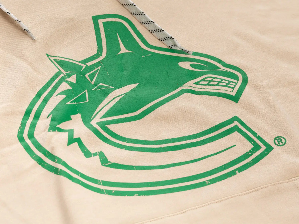 Calhoun Surf N' Skate Vancouver Canucks hoodie in oatmeal, featuring vintage Vancouver Canucks logo and cozy fabric detail.