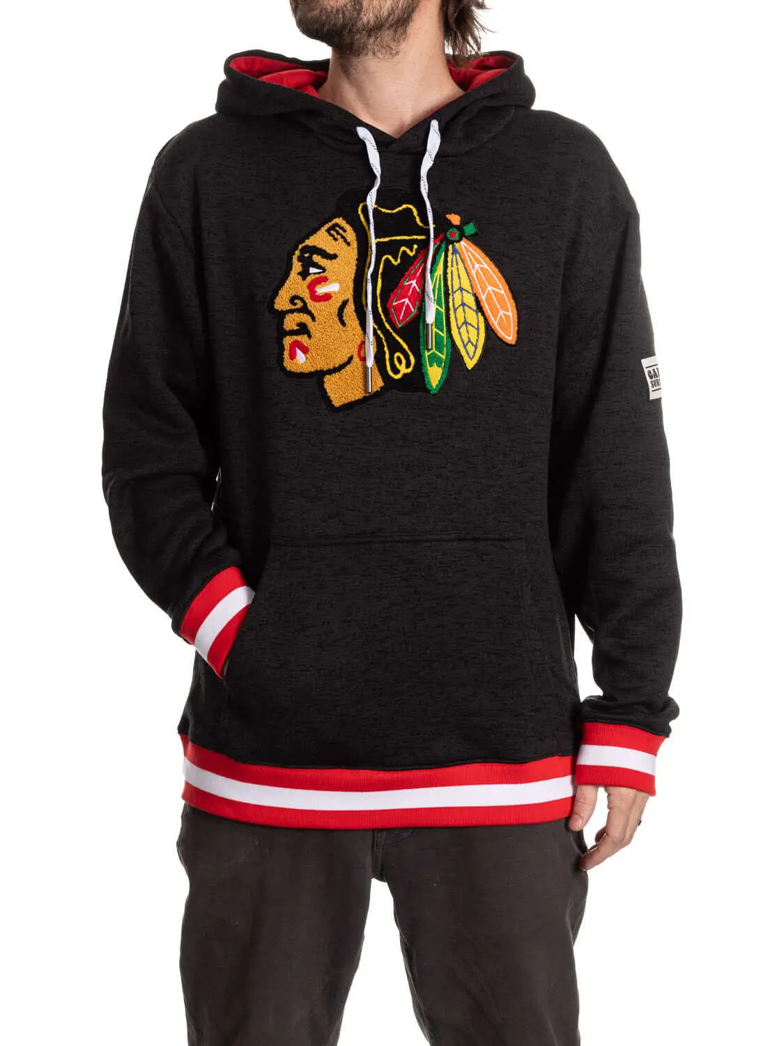 Black Chicago Blackhawks hoodie from Calhoun Surf N' Skate's Muskoka Collection, featuring team logo and black fabric.