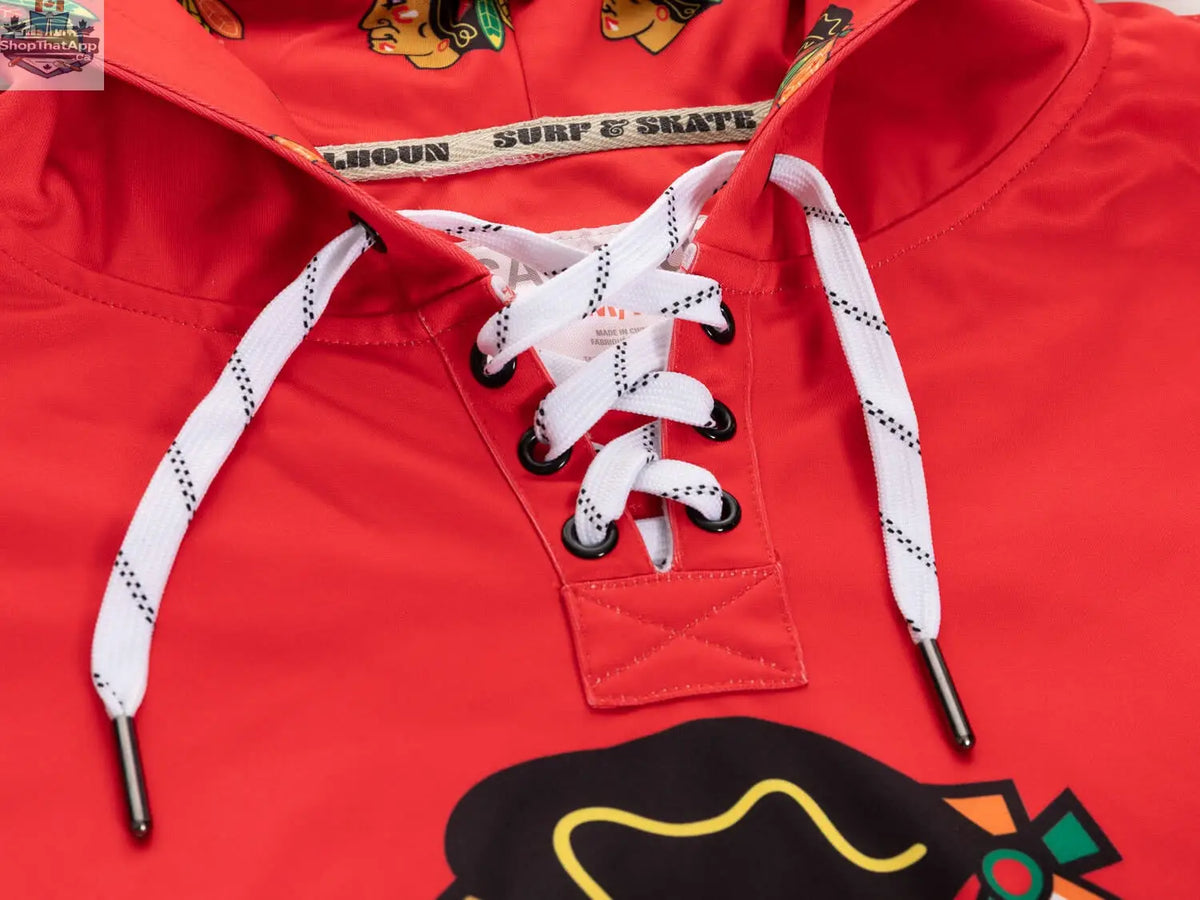Black Chicago Blackhawks hoodie with lace design by Calhoun Surf N' Skate, featuring team logo and detailed fabric pattern.
