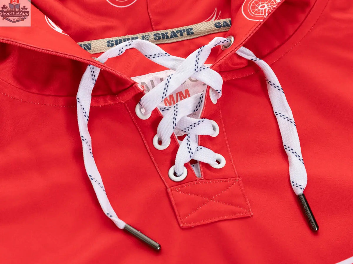 Red Detroit Red Wings hoodie by Calhoun Surf N' Skate featuring lace design and sublimation detailing, close-up view of the hoodie fabric.