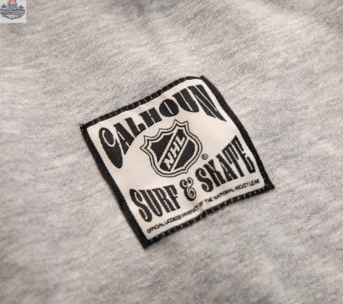 Black Boston Bruins hoodie with Muskoka-style chenille woven logo and jocktag, by Calhoun Surf N' Skate.