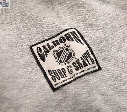 Black Boston Bruins hoodie with Muskoka-style chenille woven logo and jocktag, by Calhoun Surf N' Skate.