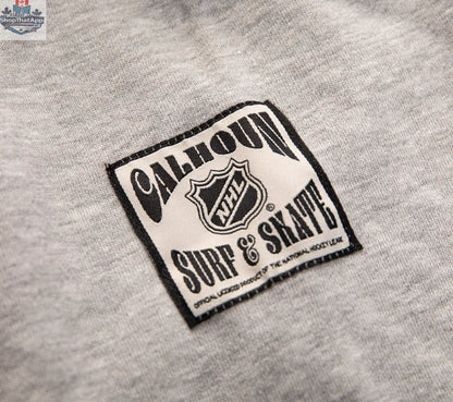 Calhoun Surf N' Skate Detroit Red Wings hoodie with Muskoka-style chenille woven NHL logo on black fabric.