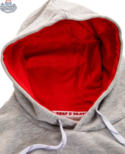 Red Detroit Red Wings hoodie with Muskoka-style premium chenille woven logo, featuring official NHL branding and detailed embroidery.