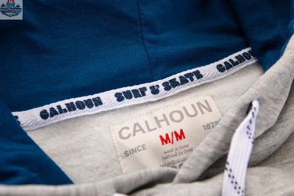 Navy Seattle Kraken hoodie by Calhoun Surf N' Skate featuring a premium chenille woven Kraken logo detail.