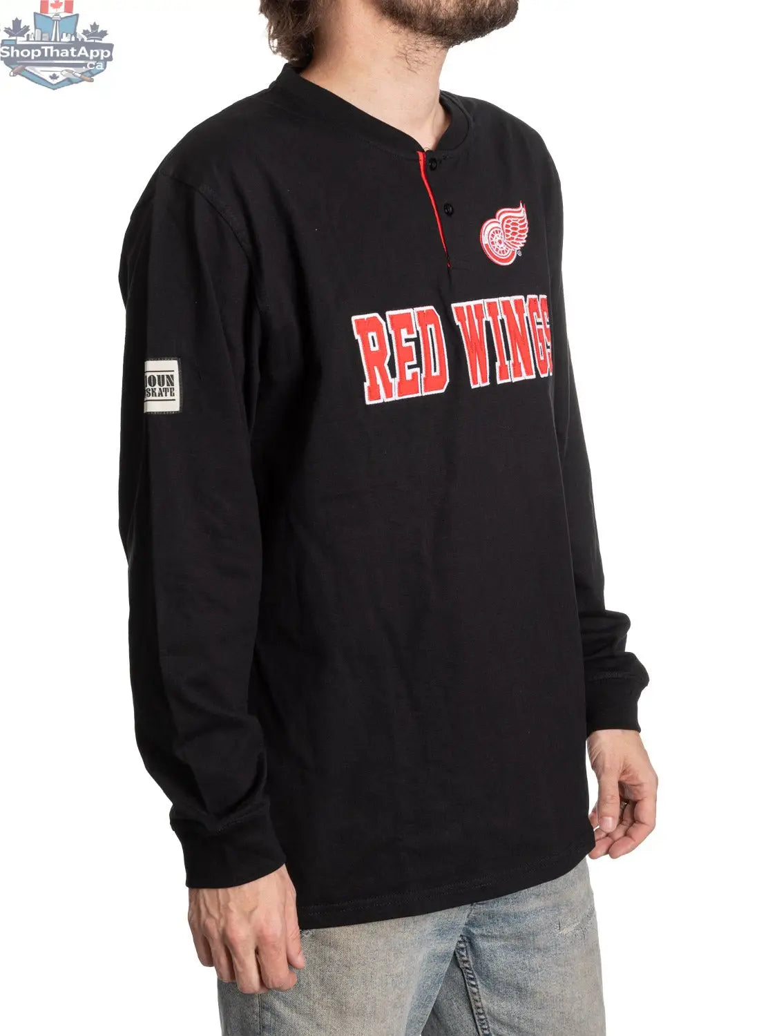 Red Wings henley long sleeve shirt for fans by Calhoun Surf N' Skate, shown from a side angle with team logo and red color.