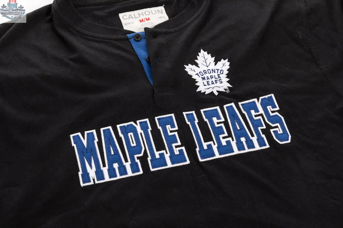 Black Toronto Maple Leafs Henley long sleeve shirt by Calhoun Surf N' Skate with team logo and detailed design.