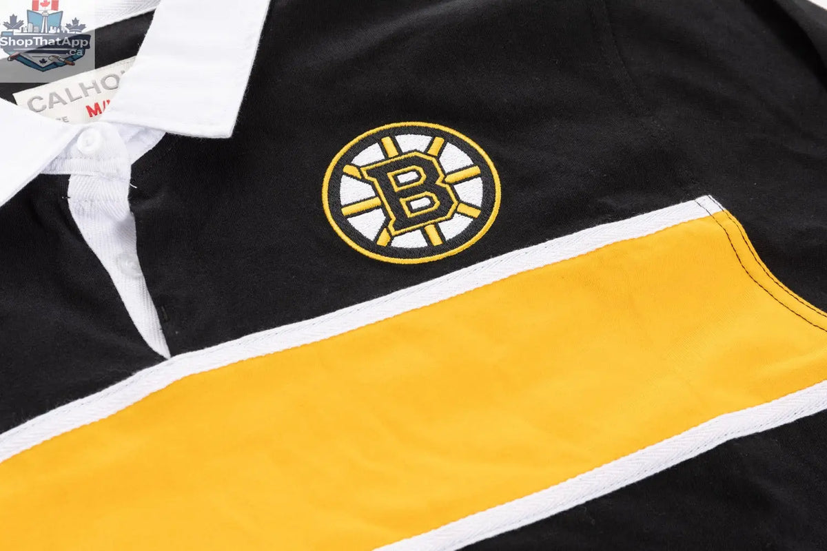 Close-up of a Boston Bruins rugby shirt by Calhoun Surf N' Skate, showing detailed team logo and fabric texture.