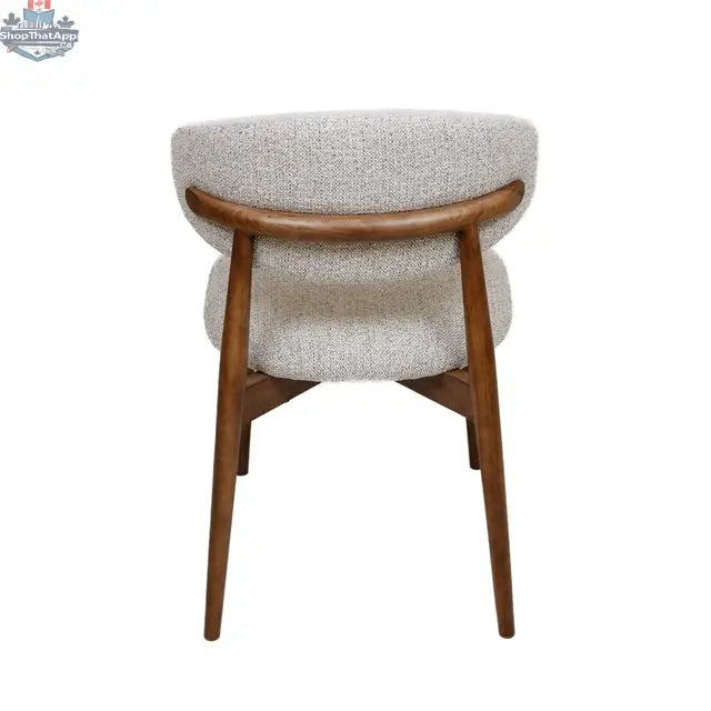 Beige fabric Cammy dining chair with walnut wooden frame, shown from the back, highlighting elegant design and comfortable seating.