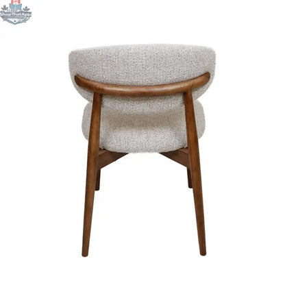Beige fabric Cammy dining chair with walnut wooden frame, shown from the back, highlighting elegant design and comfortable seating.