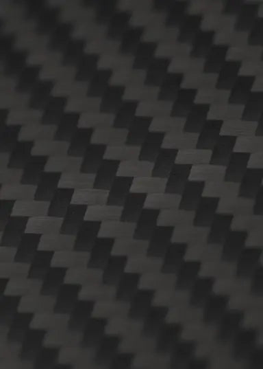 Close-up of Carbon Loom's iPhone 16 case with a sleek carbon fiber texture, showcasing its lightweight and protective design.