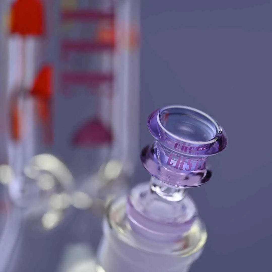 Close-up of Castle Glassworks 12-inch Shroomie Beaker Bong with purple background, featuring a glass bowl and thick 9mm glass construction.