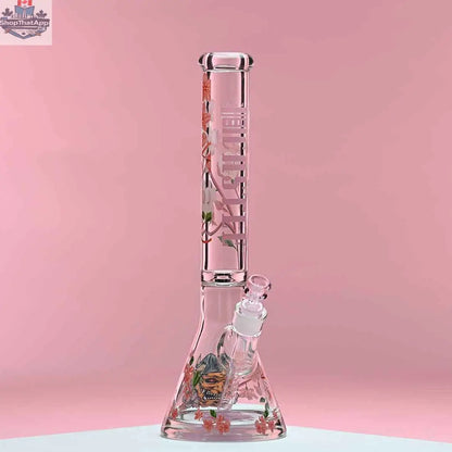 Castle Glassworks 16-inch cherry blossom beaker bong with pink background, 9mm thick glass and beaker shape for smooth hits.