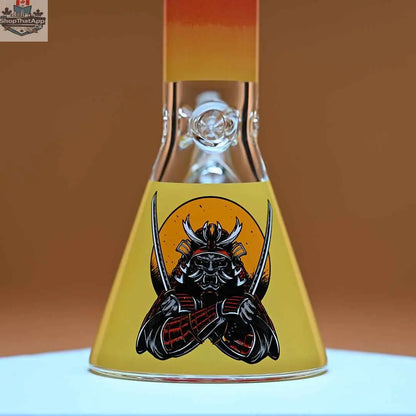 Castle Glassworks 16-inch Samurai beaker bong with amber background, featuring 9mm thick glass for smooth hits.