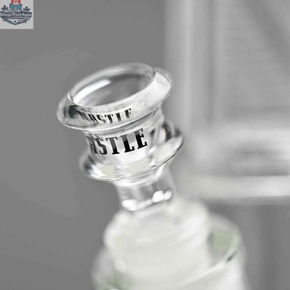 Close-up of Castle Glassworks 18-inch ultra durable beaker bong with a clear glass design and a bowl, set against a grey background.