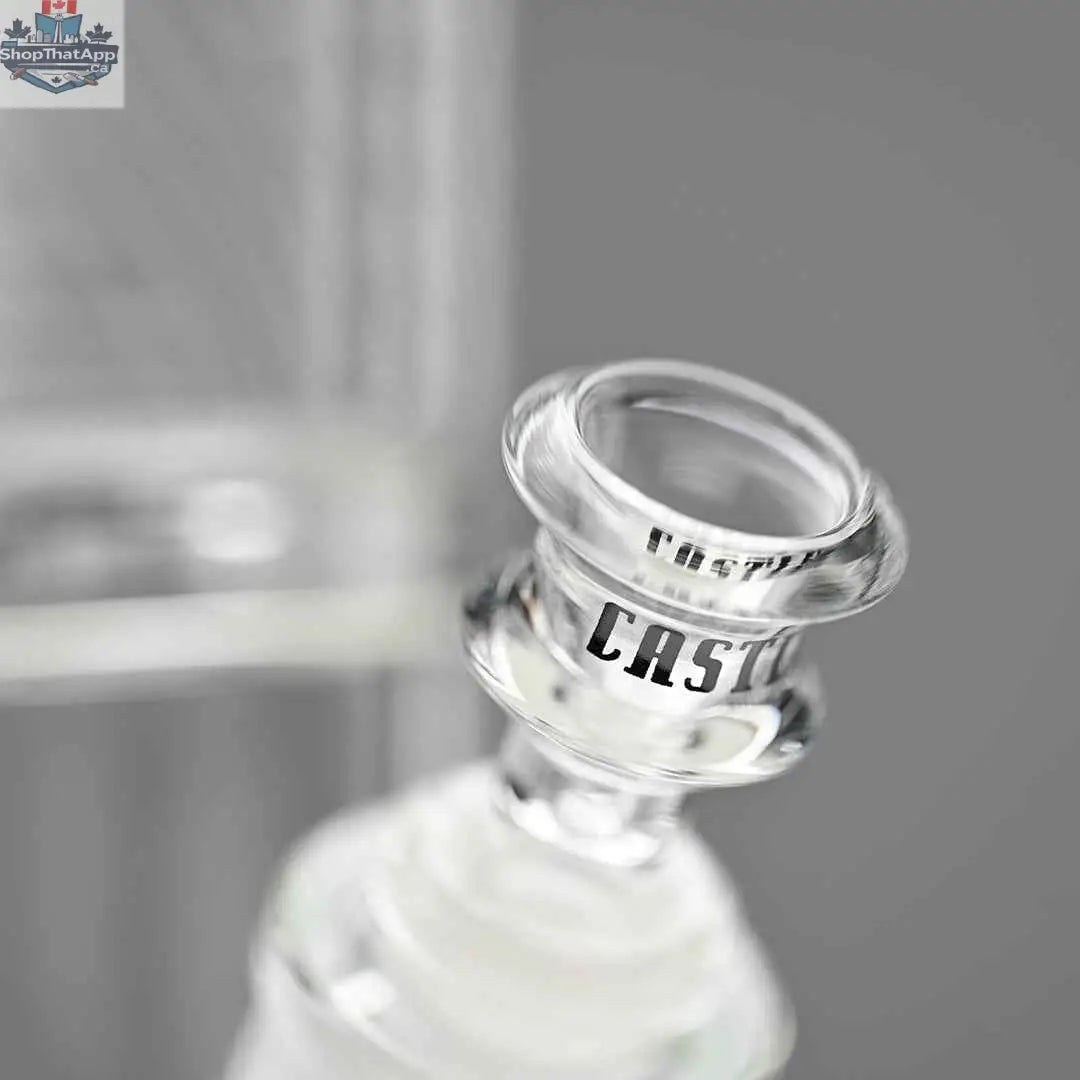 Close-up of Castle Glassworks 18-inch ultra durable beaker bong with a clear bowl on a grey background.