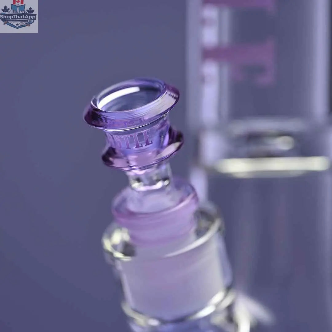 Castle Glassworks 14-inch beaker bong with purple logo, 9mm thickness, and 9-hole downstem on purple background, close-up shot.