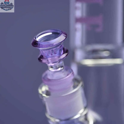 Castle Glassworks 14-inch beaker bong with purple logo, 9mm thickness, and 9-hole downstem on purple background, close-up shot.