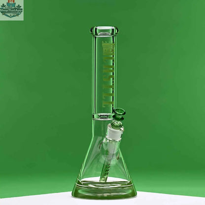 Green 14-inch Castle Glassworks beaker bong with colored logo and 9-hole downstem, against a green background.