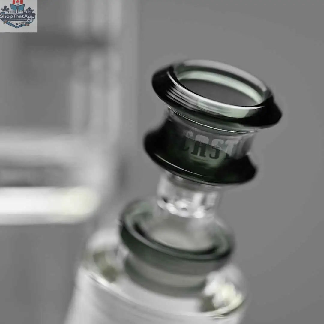 Castle Glassworks 14-inch beaker bong with colored logo and 9-hole downstem, shown with a gray background and close-up of the bowl.