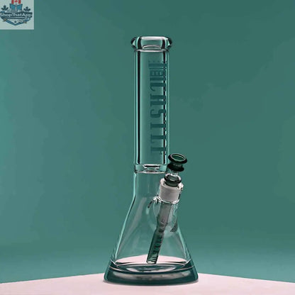 14-inch Castle Glassworks beaker bong with teal logo, clear glass, and a 9-hole downstem on a teal background.