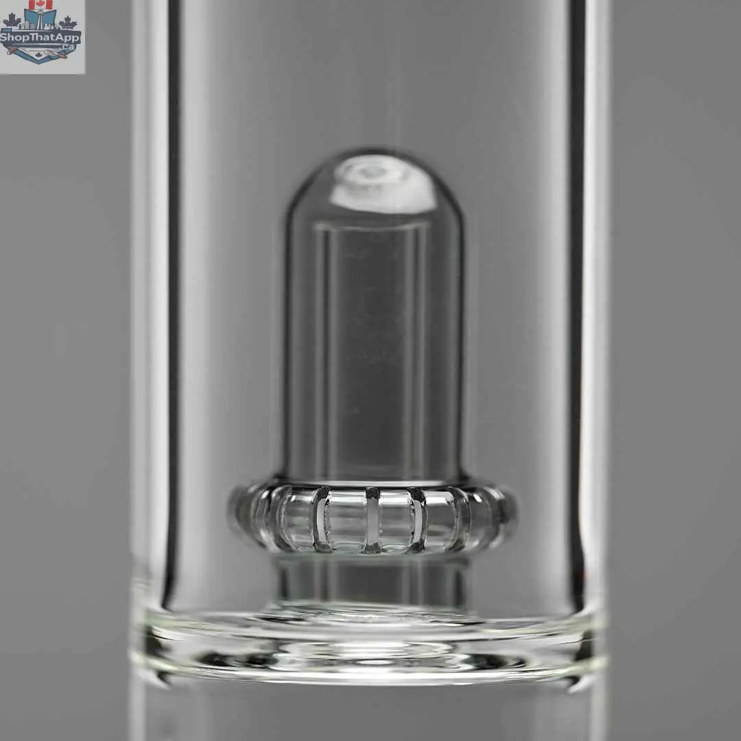 Close-up of Castle Glassworks double showerhead beaker bong with gray background, showcasing its percolator for smooth hits.