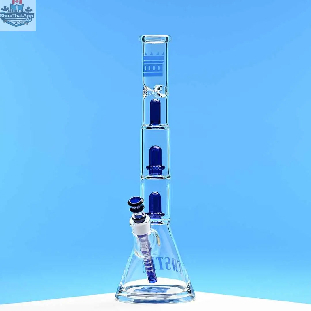 Blue Castle Glassworks double showerhead beaker bong with blue background, 18-inch height, and innovative design for smooth hits.