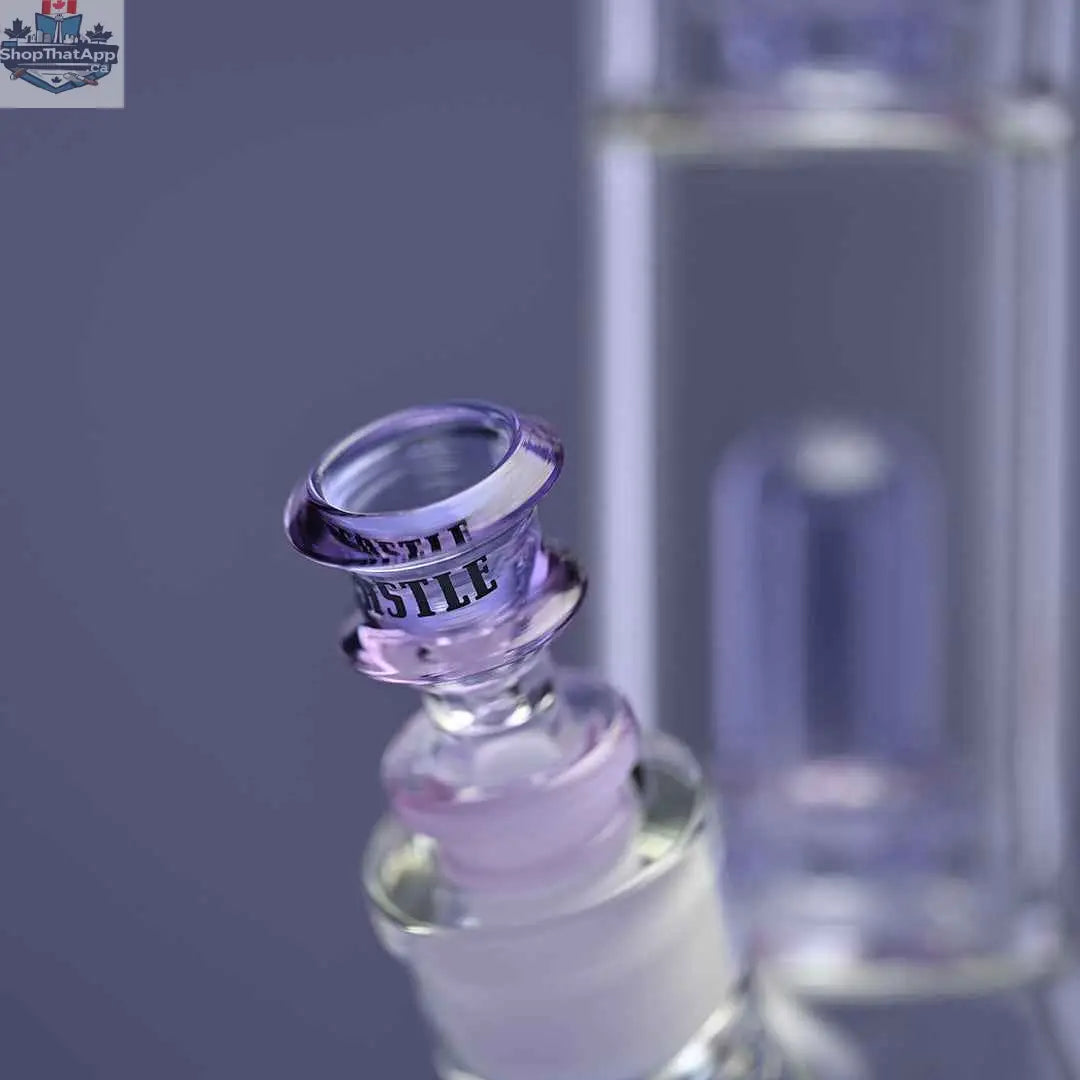 Castle Glassworks double showerhead beaker bong with purple color, close-up of the bong and bowl on purple background.