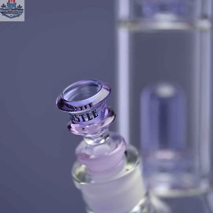 Castle Glassworks double showerhead beaker bong with purple color, close-up of the bong and bowl on purple background.