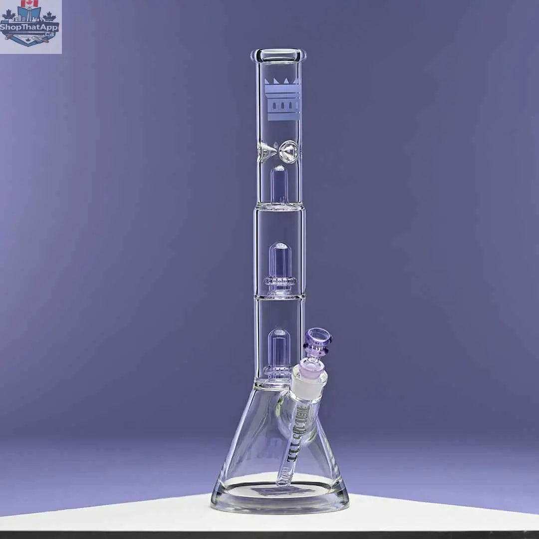 Purple Castle Glassworks double showerhead beaker bong with a sleek design, set against a purple background, for smooth smoking hits.