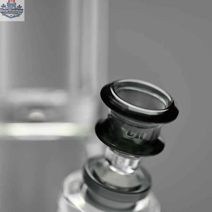 Close-up of Castle Glassworks 18-inch glass beaker bong with grey logo and thick 9mm glass, shown against a grey background.