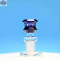 Blue 14mm borosilicate glass bowl with disk design, durable and transparent, by Castle Glassworks on a blue background.