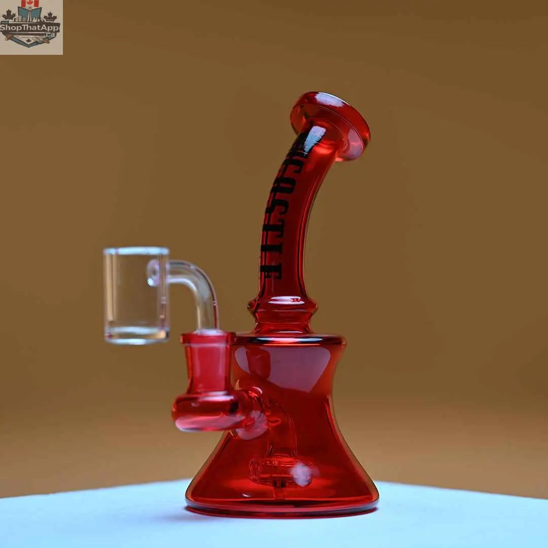 Red electroplated 7-inch high-performance mini dab rig by Castle Glassworks on an amber background.