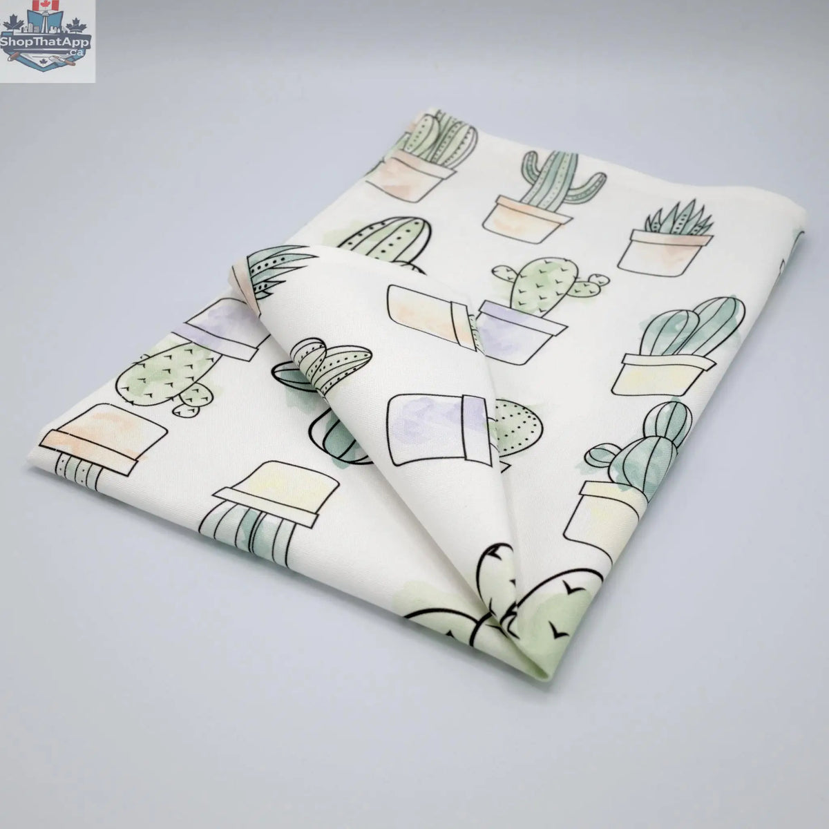 Folded Hem And Tassel Desert Haze watercolor cactus printed kitchen towel featuring vibrant desert-inspired artwork.