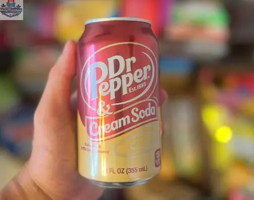 Can of Dr Pepper Cream Soda from Snack Bar Co, 355ml, with creamy soda beverage and vintage-style label visible.