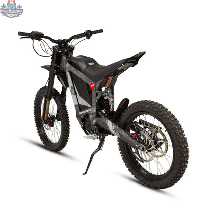 E-Vélo EUNORAU QUEBEC EKIDS16 1.0 R1 e-dirt bike for kids, featuring colorful frame, rugged tires, and handlebar controls.