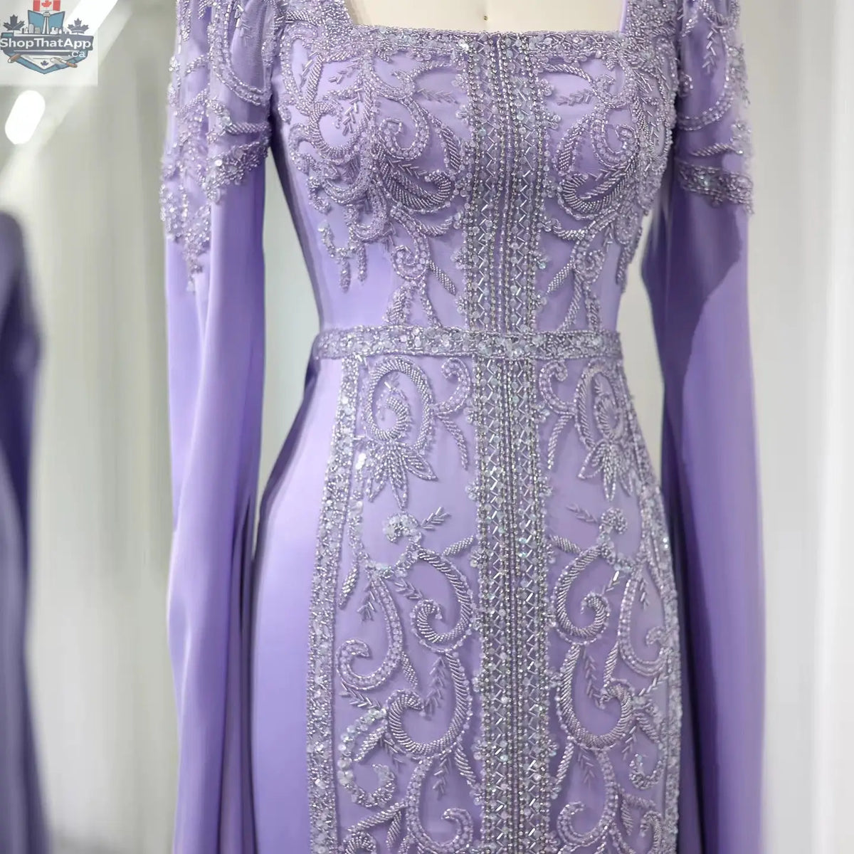 Elegant Threads evening kaftan gown with cape sleeves, perfect for elegant occasions, featuring flowing fabric and intricate design.