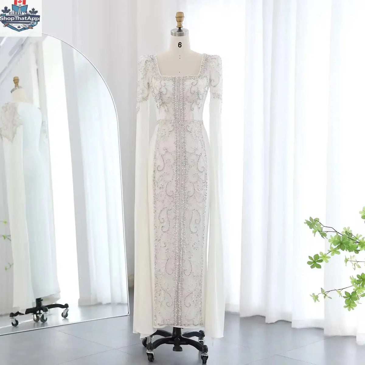 Elegant Threads evening kaftan gown with cape sleeves, perfect for elegant occasions, featuring flowing fabric and intricate detailing.