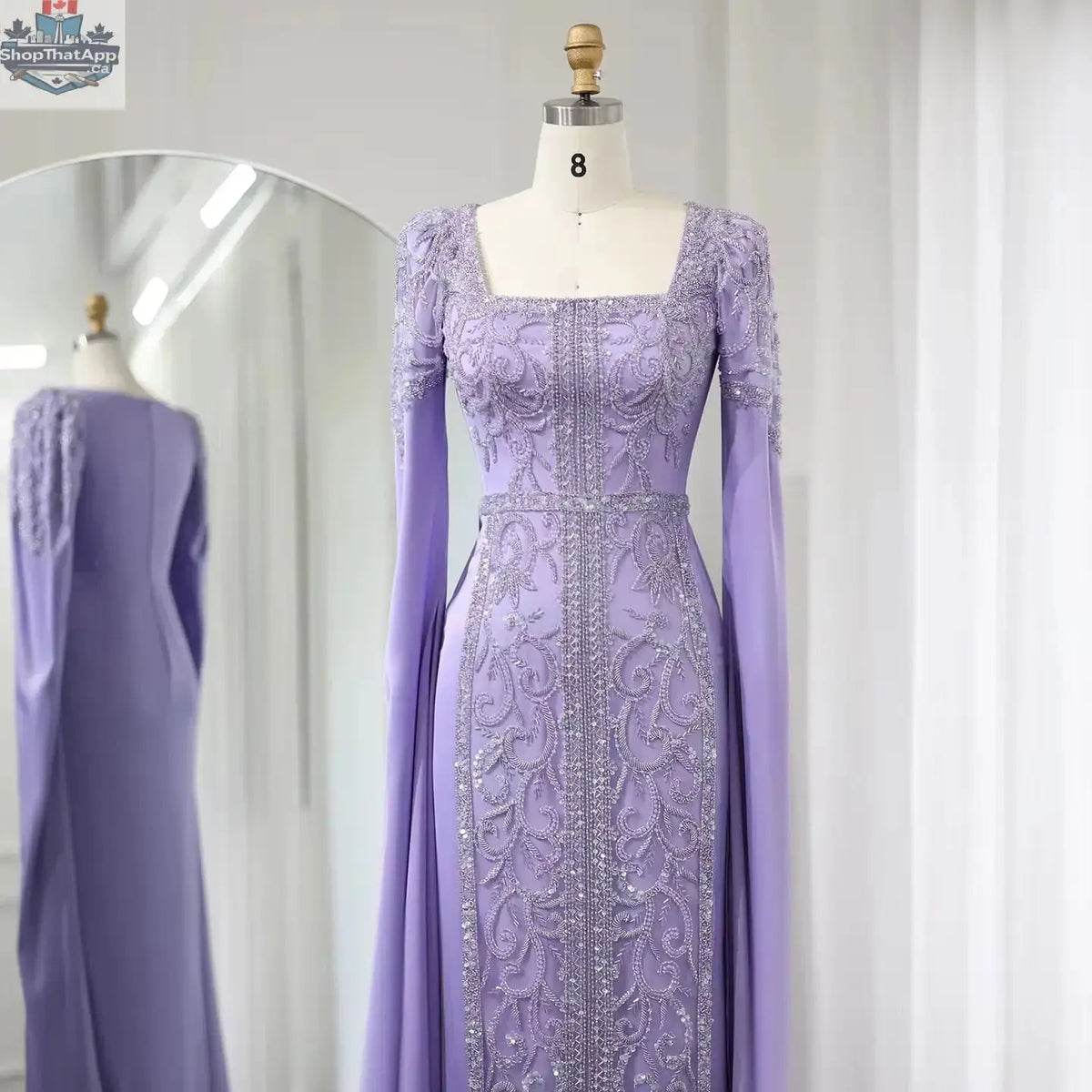 Elegant Threads evening kaftan gown with cape sleeves, perfect for elegant occasions, featuring flowing fabric and intricate details.