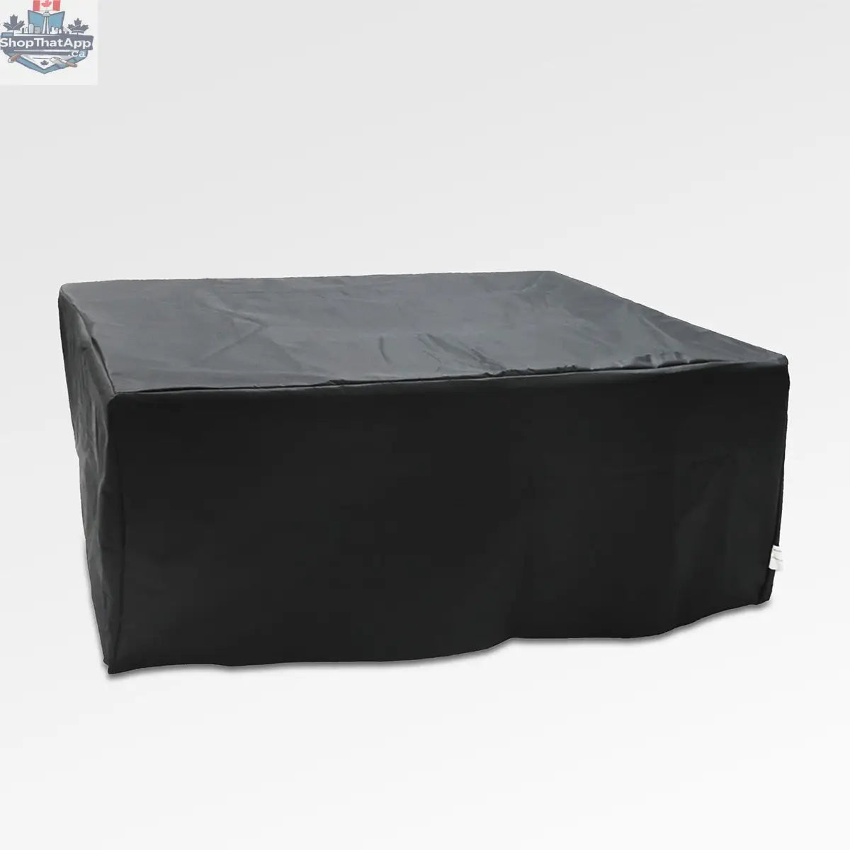 Close-up of Enclover outdoor black aluminum fire pit table cover with wind guard, showing detailed fabric and secure fit.