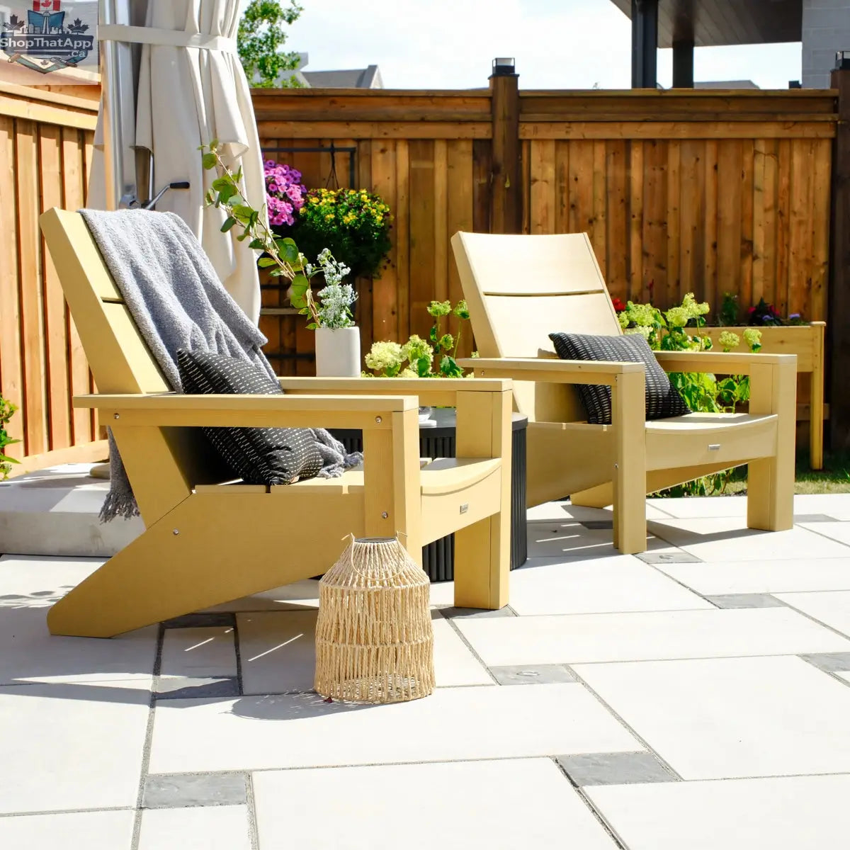 Enclover Acacia conversational set with modern Muskoka chairs and Sunbrella cushions for outdoor comfort and stylish relaxation.