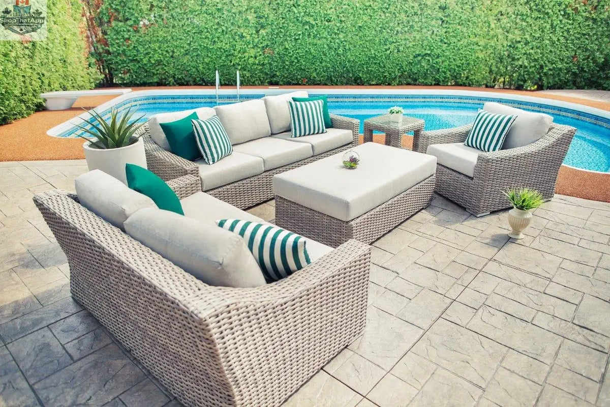 Enclover Tulip Lounge Chair with Sunbrella® cushions, shown beside a pine sling loveseat in a stylish outdoor seating setup.