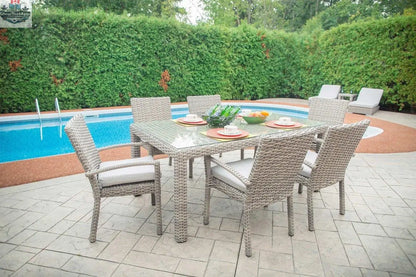 Enclover Tulip 7-piece outdoor dining set with sunbrella cushions, featuring a modern table and matching chairs for outdoor meals.