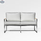 Enclover Acacia loveseat with Sunbrella® cushions, durable frame, and comfortable seating in a natural outdoor setting.