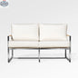 Enclover Acacia loveseat with durable frame and Sunbrella® cushions, shown from the front with bird's eye view fabric pattern.